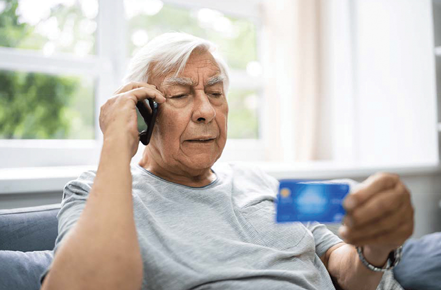 An elderly man sharing his card details. Source: caregivercalifornia
